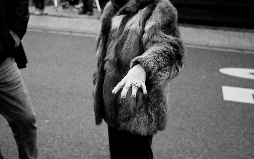 Picobello (2026) – Behind the Scenes Still - production design Picobello (2026) – Production Design for short film, black-and-white shot of fur coat and hand with ring, retro street mood, cinematic detai