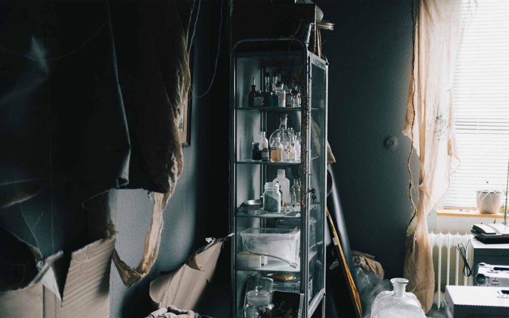Picobello (2026) – Behind the Scenes Still - production design Picobello (2026) – Production Design for short film, metal locker with glass doors, sterile instruments and jars arranged in cool, clinical lighting